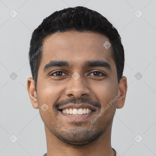 Joyful latino young-adult male with short  black hair and brown eyes