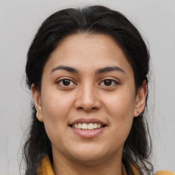 Joyful white young-adult female with medium  brown hair and brown eyes