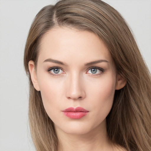 Neutral white young-adult female with long  brown hair and grey eyes