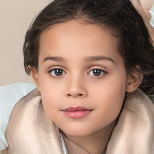 Joyful white child female with long  brown hair and brown eyes