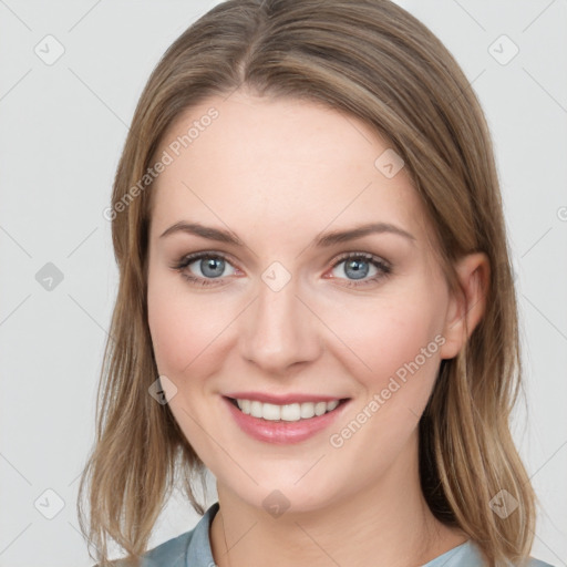 Joyful white young-adult female with medium  brown hair and blue eyes