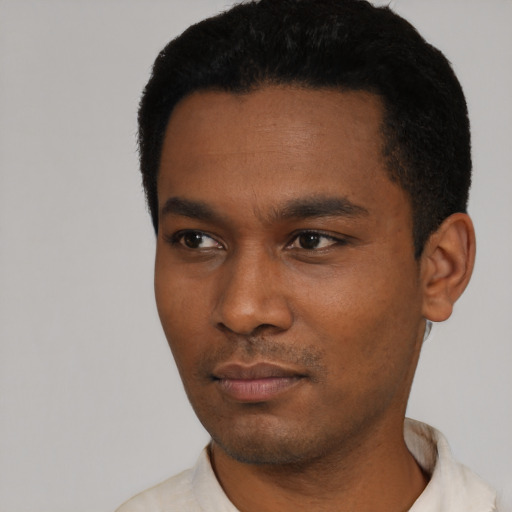 Neutral black young-adult male with short  black hair and brown eyes