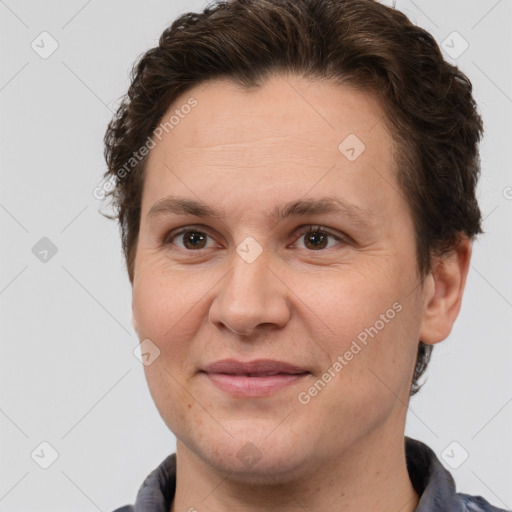 Joyful white adult female with short  brown hair and brown eyes