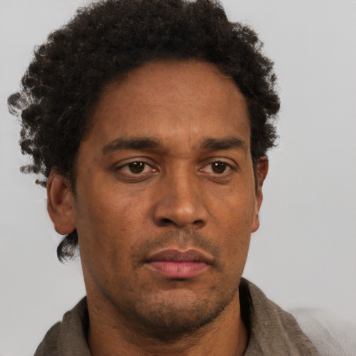 Neutral black adult male with short  brown hair and brown eyes