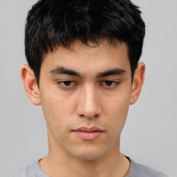 Neutral asian young-adult male with short  black hair and brown eyes