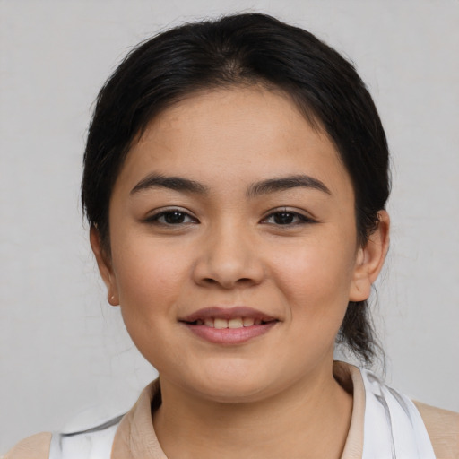 Joyful white young-adult female with medium  black hair and brown eyes