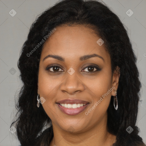 Joyful black young-adult female with long  brown hair and brown eyes