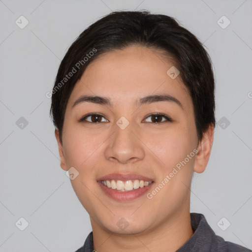 Joyful asian young-adult female with short  brown hair and brown eyes