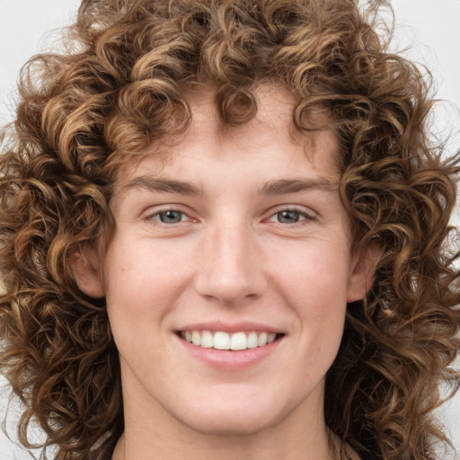 Joyful white young-adult female with medium  brown hair and green eyes