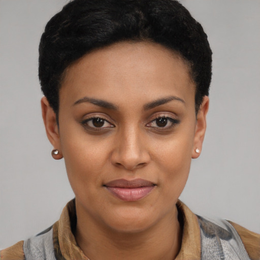 Joyful latino young-adult female with short  brown hair and brown eyes