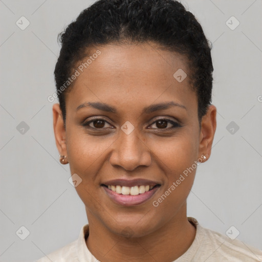 Joyful black young-adult female with short  black hair and brown eyes