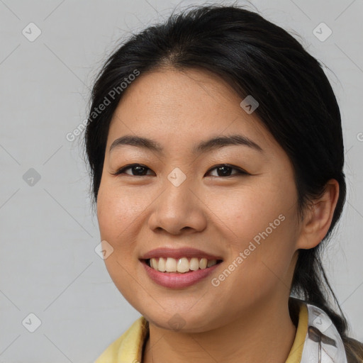 Joyful asian young-adult female with medium  brown hair and brown eyes