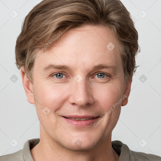 Joyful white adult female with short  brown hair and grey eyes