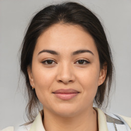 Joyful asian young-adult female with medium  brown hair and brown eyes