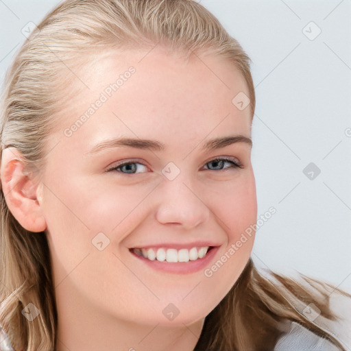 Joyful white young-adult female with long  brown hair and blue eyes