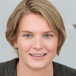 Joyful white young-adult female with medium  brown hair and blue eyes