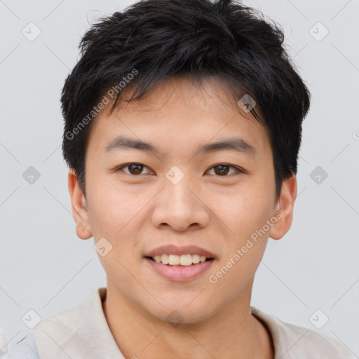 Joyful asian young-adult male with short  brown hair and brown eyes