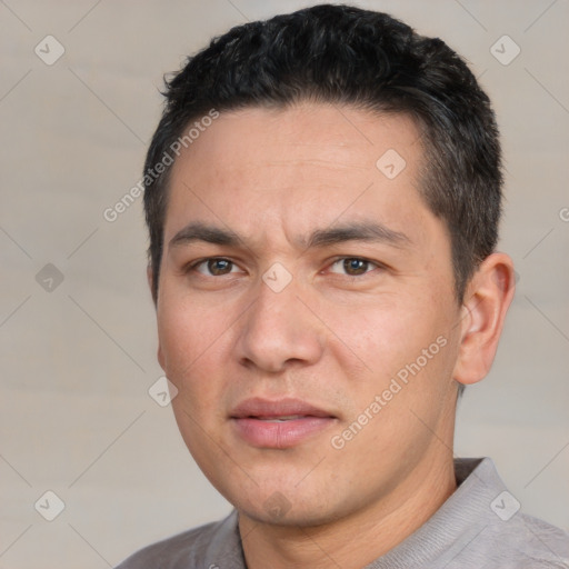 Joyful white adult male with short  black hair and brown eyes