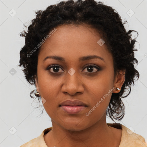 Joyful black young-adult female with medium  brown hair and brown eyes