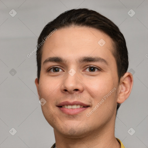 Joyful white young-adult male with short  brown hair and brown eyes