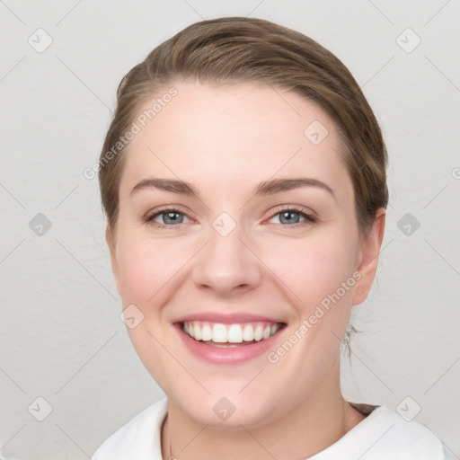 Joyful white young-adult female with medium  brown hair and blue eyes