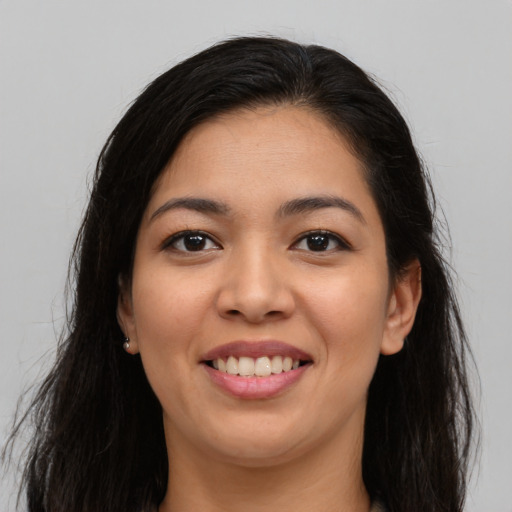 Joyful asian young-adult female with long  brown hair and brown eyes