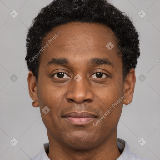 Joyful black young-adult male with short  black hair and brown eyes