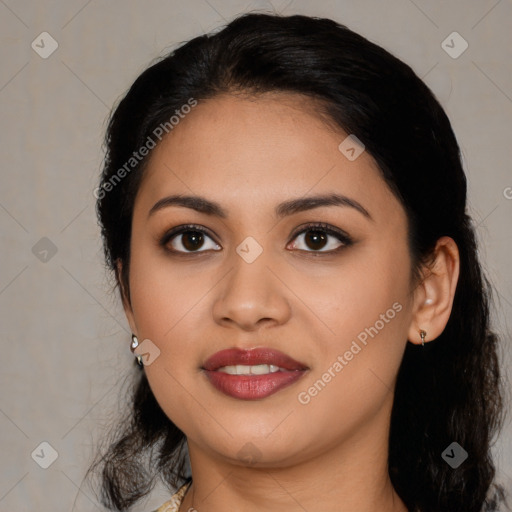 Joyful latino young-adult female with long  black hair and brown eyes