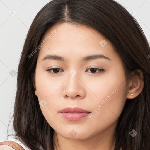 Joyful asian young-adult female with long  brown hair and brown eyes