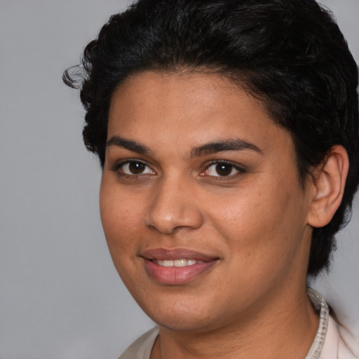 Joyful latino young-adult female with short  brown hair and brown eyes