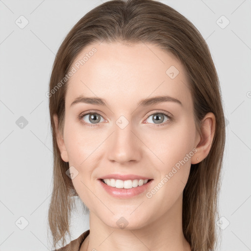 Joyful white young-adult female with long  brown hair and grey eyes