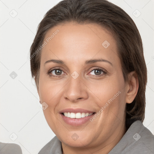 Joyful white adult female with long  brown hair and brown eyes