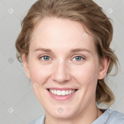 Joyful white young-adult female with medium  brown hair and blue eyes