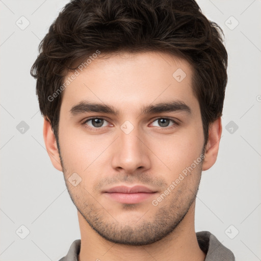 Neutral white young-adult male with short  brown hair and brown eyes