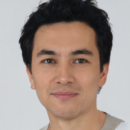 Joyful asian young-adult male with short  black hair and brown eyes