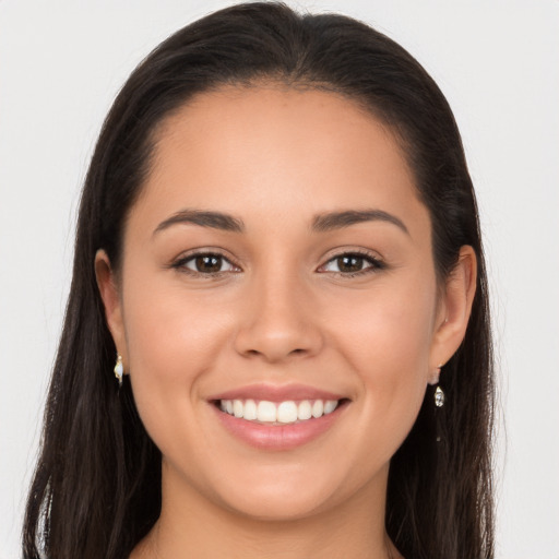 Joyful white young-adult female with long  brown hair and brown eyes