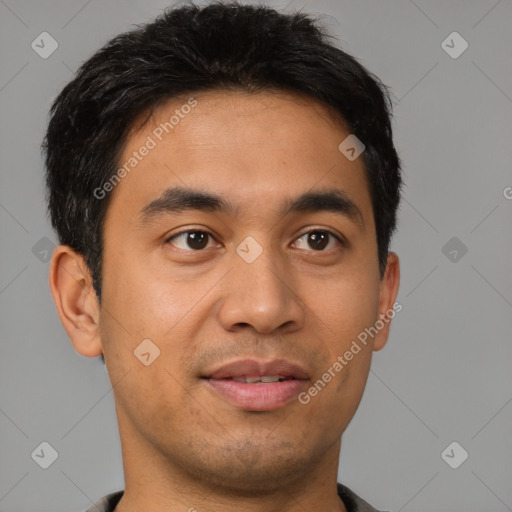 Joyful latino young-adult male with short  brown hair and brown eyes