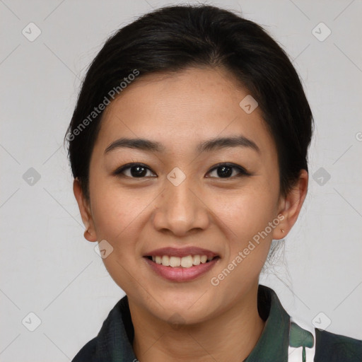 Joyful asian young-adult female with short  brown hair and brown eyes
