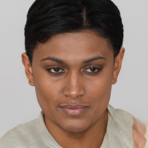 Joyful latino young-adult female with short  brown hair and brown eyes