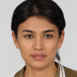 Joyful asian young-adult female with short  brown hair and brown eyes