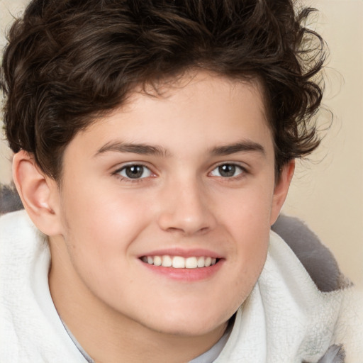 Joyful white child male with medium  brown hair and brown eyes