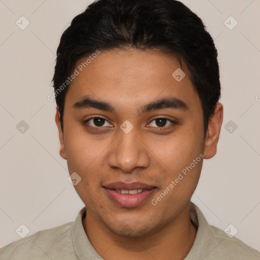 Joyful latino young-adult male with short  brown hair and brown eyes