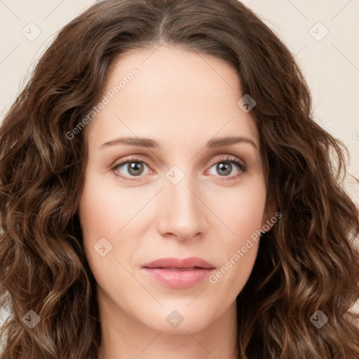 Joyful white young-adult female with long  brown hair and green eyes