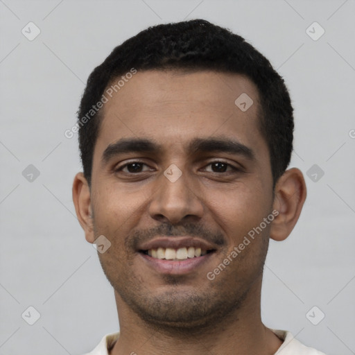 Joyful latino young-adult male with short  black hair and brown eyes