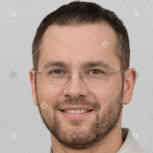 Joyful white adult male with short  brown hair and brown eyes