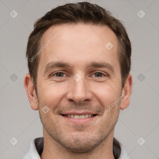 Joyful white adult male with short  brown hair and grey eyes