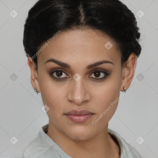 Joyful latino young-adult female with short  brown hair and brown eyes