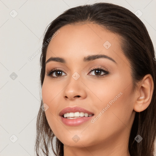 Joyful white young-adult female with long  black hair and brown eyes