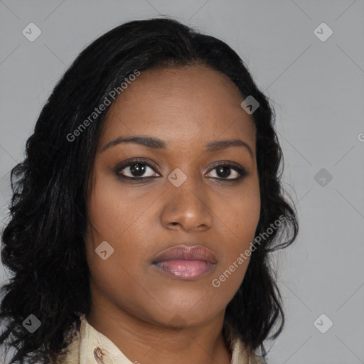 Joyful black young-adult female with long  black hair and brown eyes