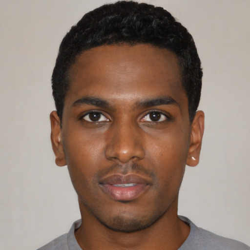 Neutral black young-adult male with short  black hair and brown eyes